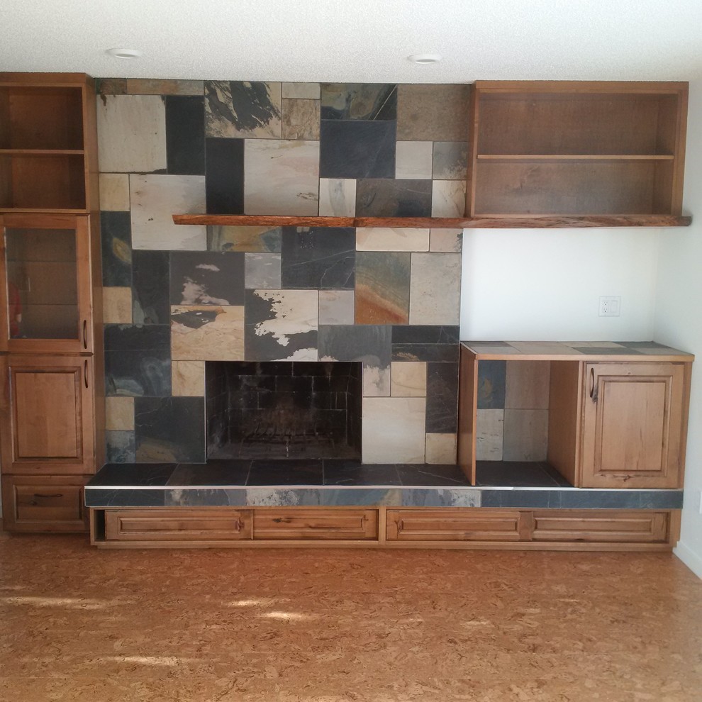 Photo of a rustic games room in Edmonton with a standard fireplace and a tiled fireplace surround.