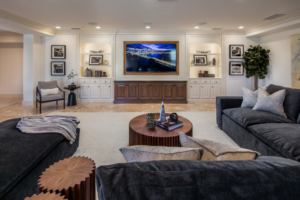 Photo of a mediterranean games room in Los Angeles with white walls, a wall mounted tv and beige floors.