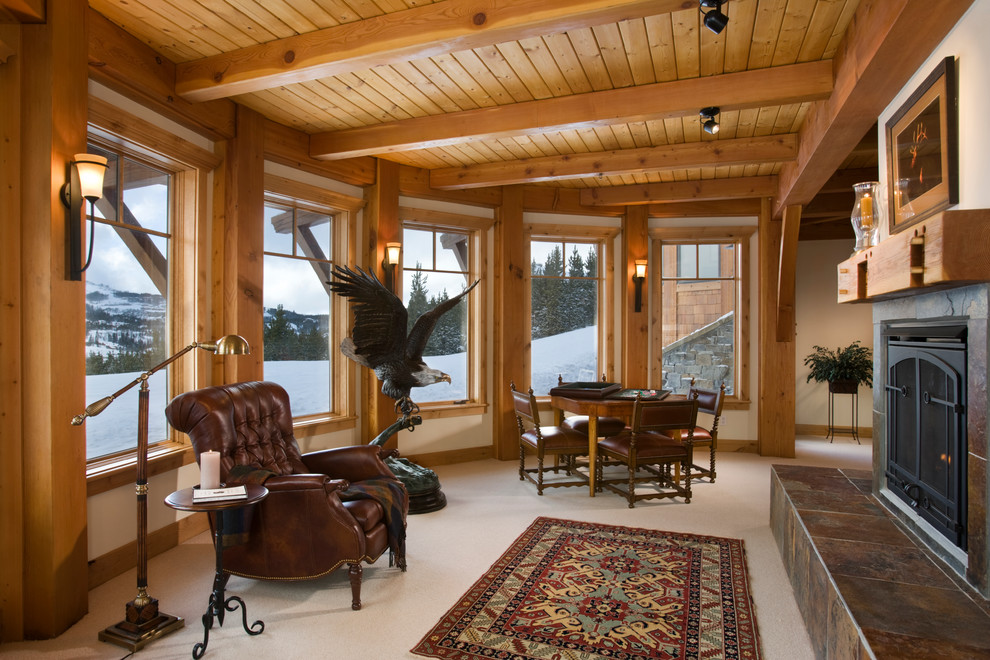 Cette photo montre une salle de séjour craftsman de taille moyenne et ouverte avec salle de jeu, un mur beige, moquette, une cheminée standard et un manteau de cheminée en pierre.