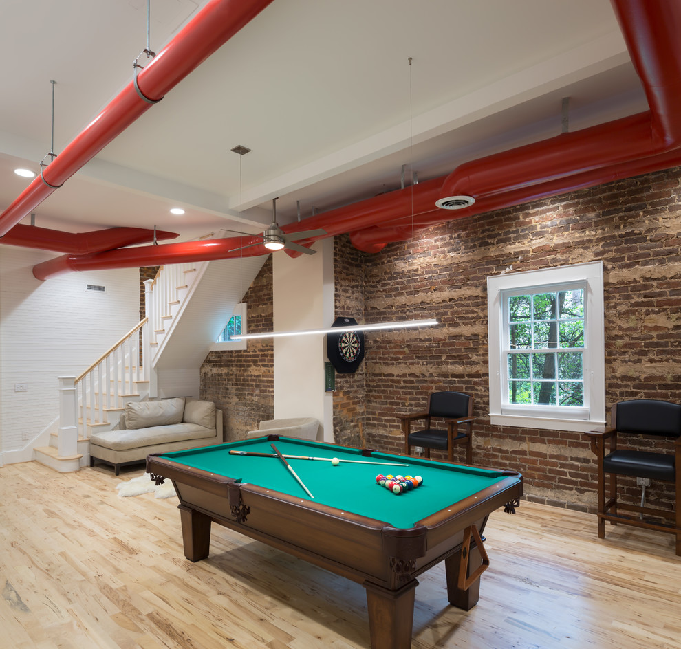 This is an example of a medium sized traditional open plan games room in Other with a game room, light hardwood flooring, no fireplace, beige floors, white walls and a wall mounted tv.