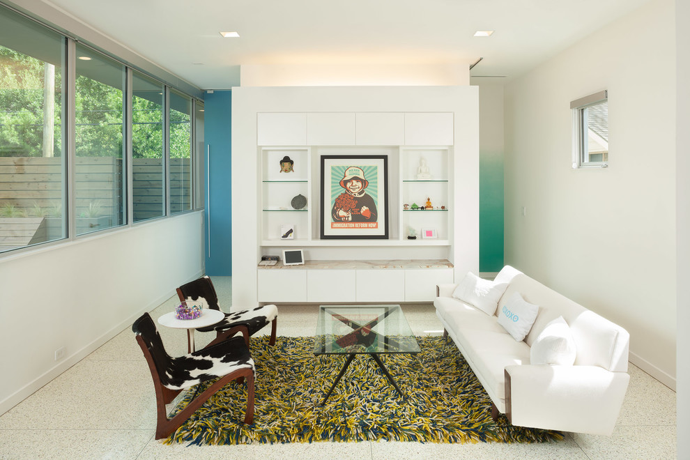 Family room - contemporary family room idea in Houston with white walls