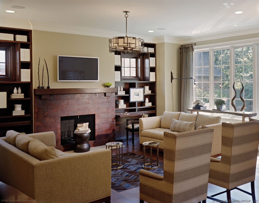 Traditional games room in Detroit with beige walls, a standard fireplace and a wall mounted tv.