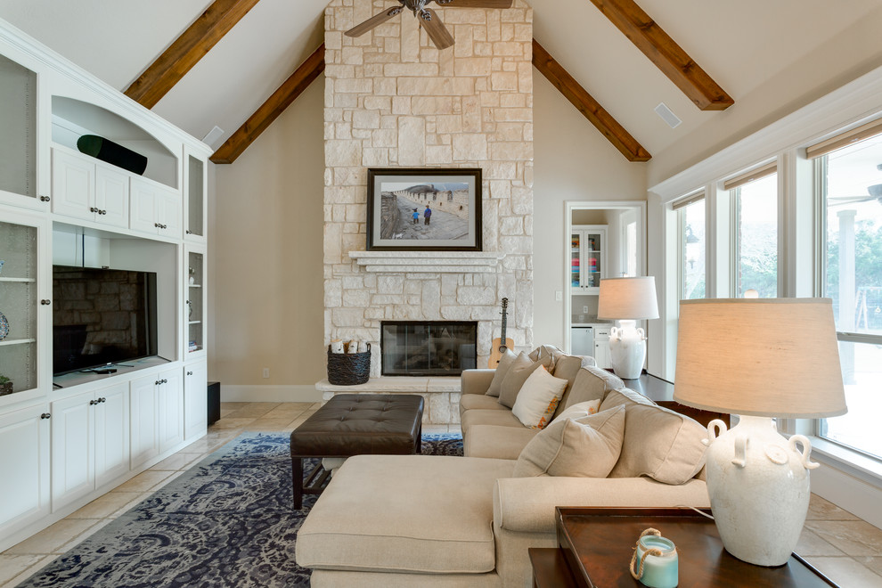 Family room - large transitional open concept travertine floor and beige floor family room idea in Dallas with beige walls, a standard fireplace, a stone fireplace and a media wall