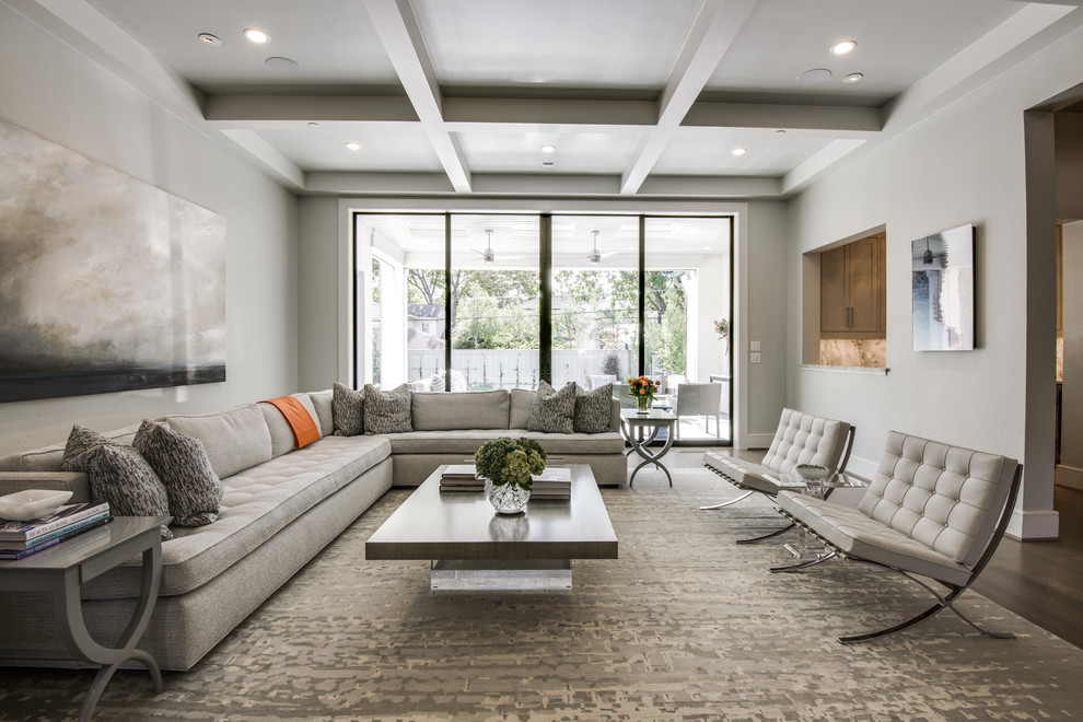 Mid-sized transitional enclosed dark wood floor and brown floor family room photo in Dallas with gray walls, a standard fireplace, a concrete fireplace and a wall-mounted tv