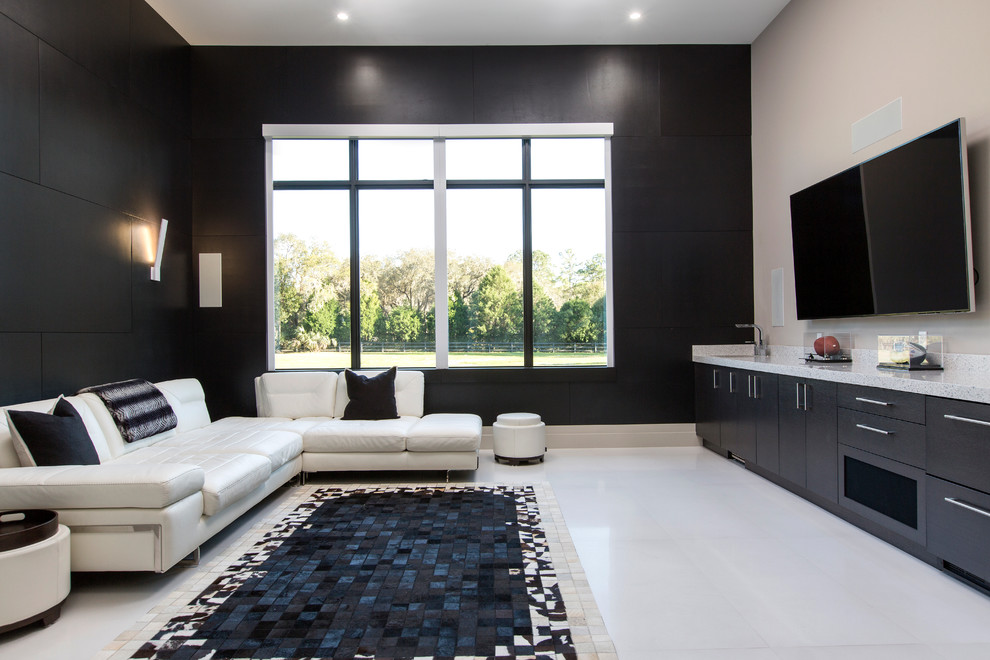This is an example of a modern games room in Orlando with black walls, porcelain flooring, no fireplace, a wall mounted tv and white floors.