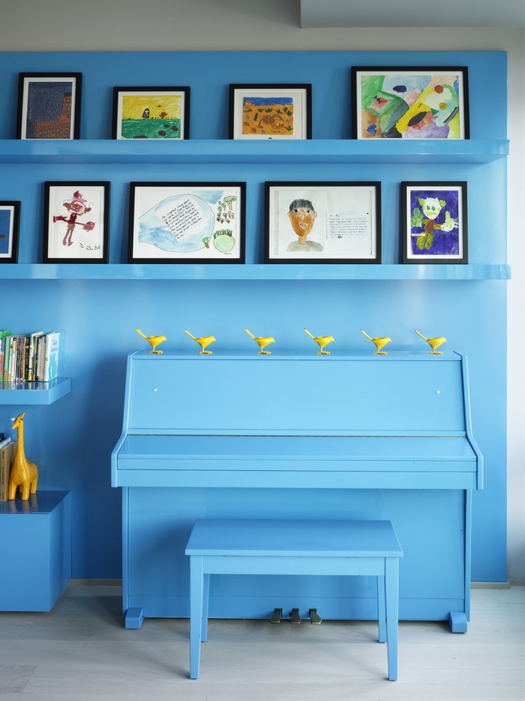 Eclectic family room photo in New York with blue walls
