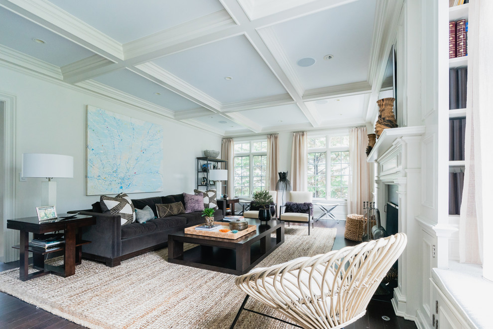 Photo of a medium sized bohemian enclosed games room in New York with white walls, dark hardwood flooring, a standard fireplace, a wooden fireplace surround and brown floors.