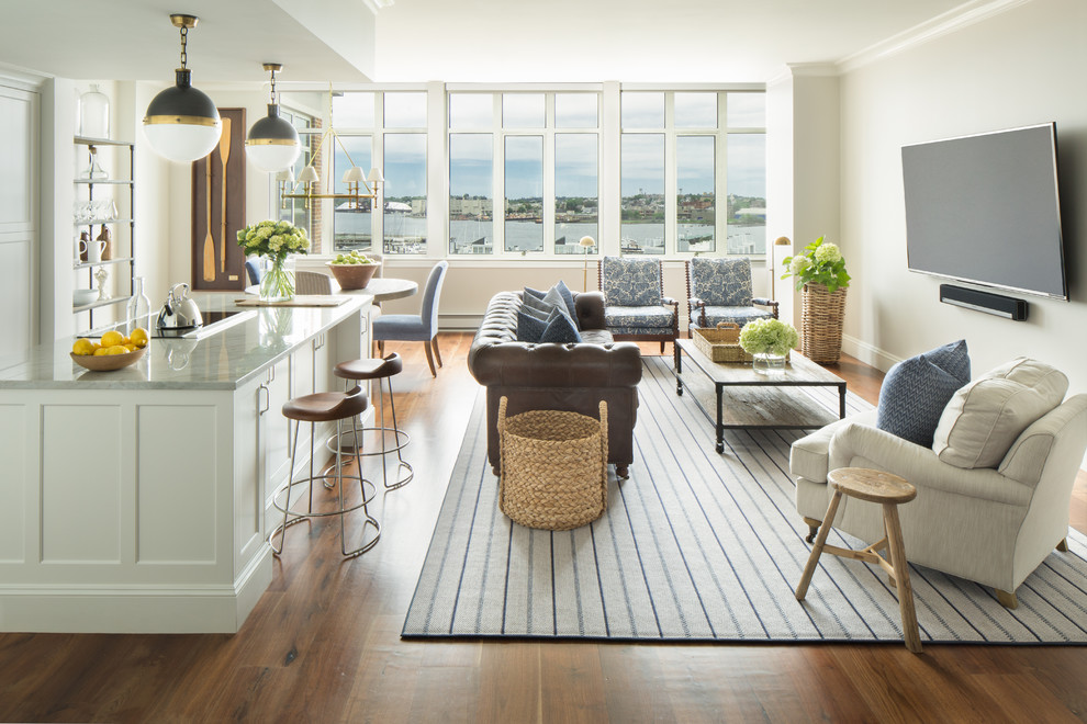 Inspiration for a large transitional open concept medium tone wood floor family room remodel in Boston with white walls and a wall-mounted tv