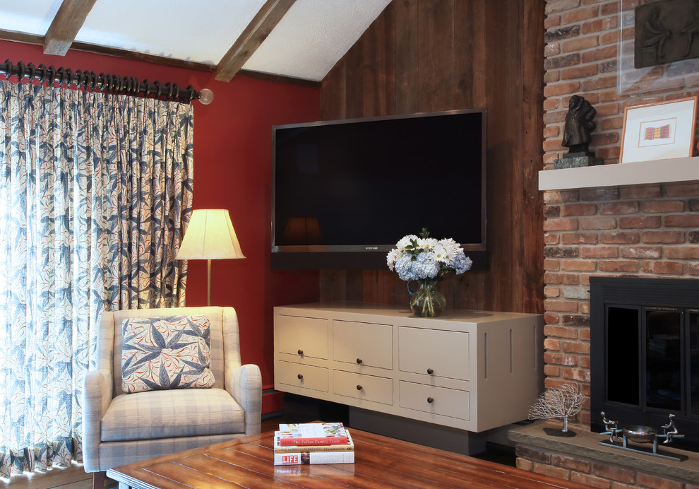 Example of a mid-sized transitional enclosed dark wood floor family room design in New York with red walls, a standard fireplace, a brick fireplace and a wall-mounted tv