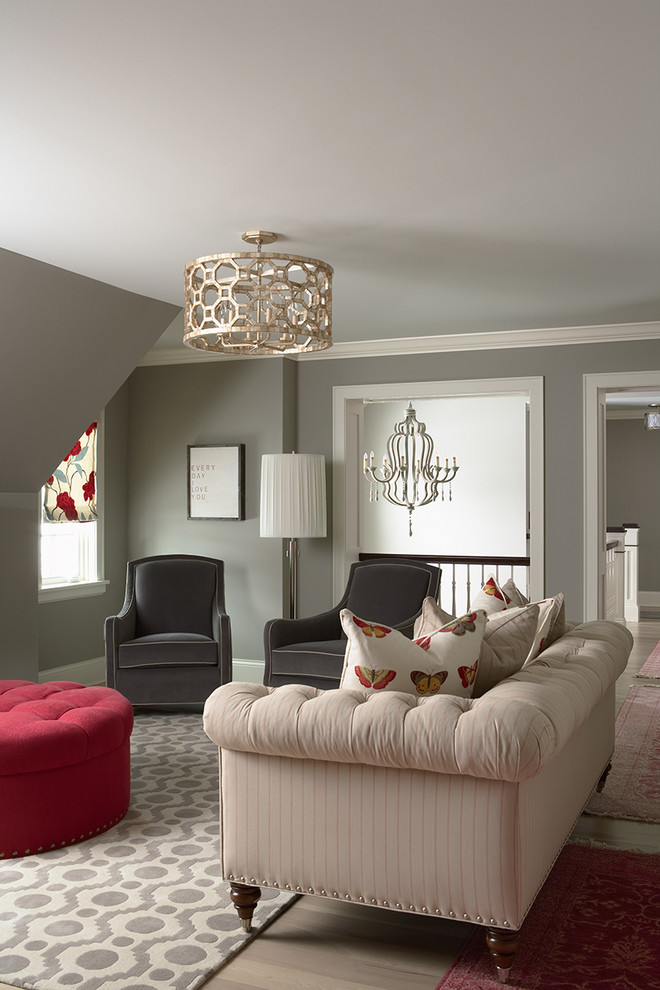 Example of a classic medium tone wood floor family room design in Minneapolis with gray walls