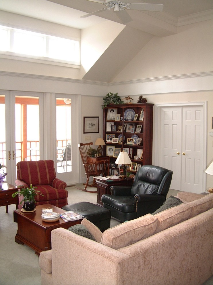 This is an example of a medium sized traditional open plan games room in Other with pink walls, carpet and a reading nook.