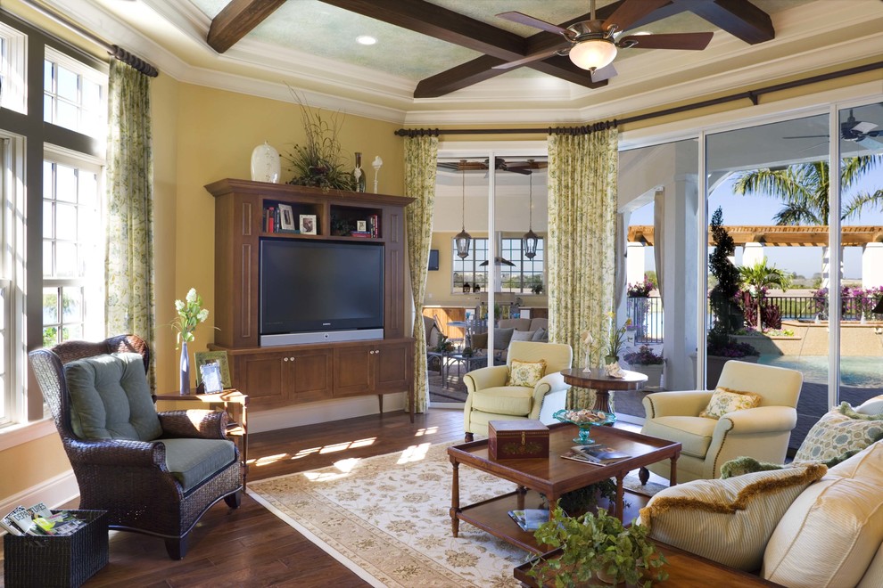 Example of a tuscan family room design in Tampa