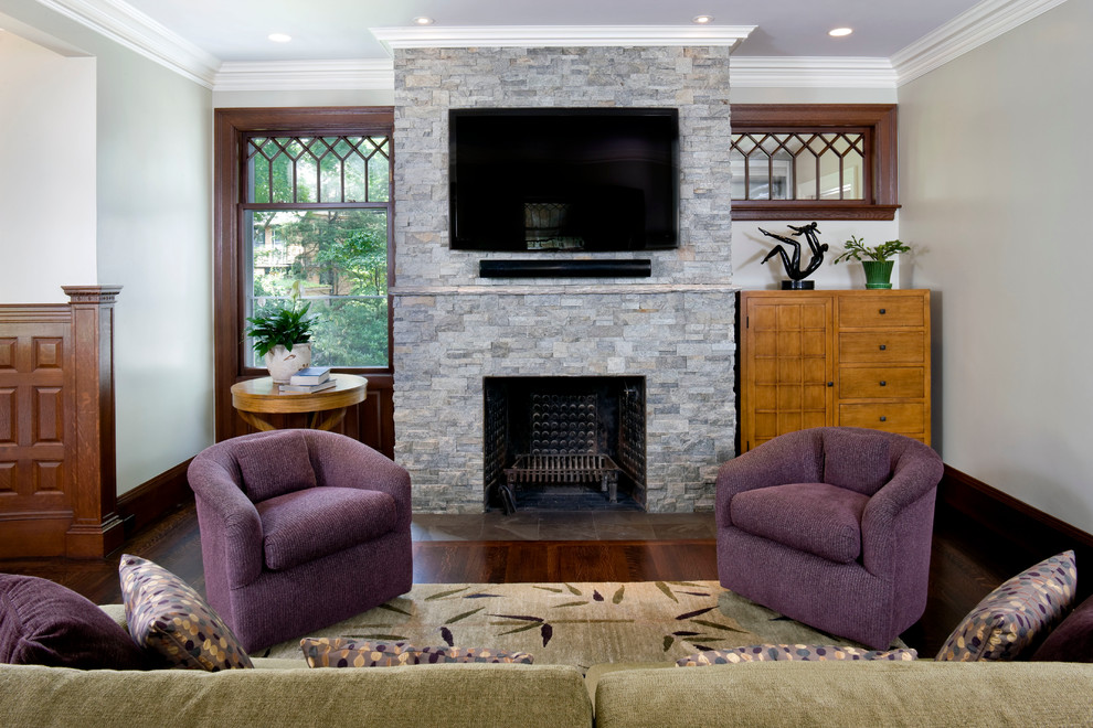 Inspiration for a mid-sized transitional open concept dark wood floor and brown floor family room remodel in Boston with gray walls, a standard fireplace and a stone fireplace
