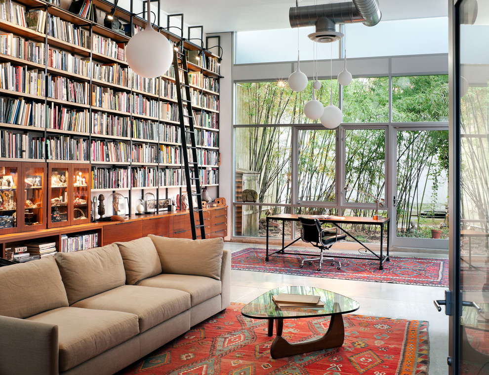 Inspiration for a contemporary family room library remodel in New York
