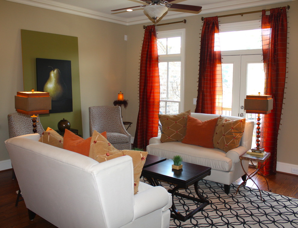 Example of a small transitional enclosed medium tone wood floor family room design in Atlanta with beige walls