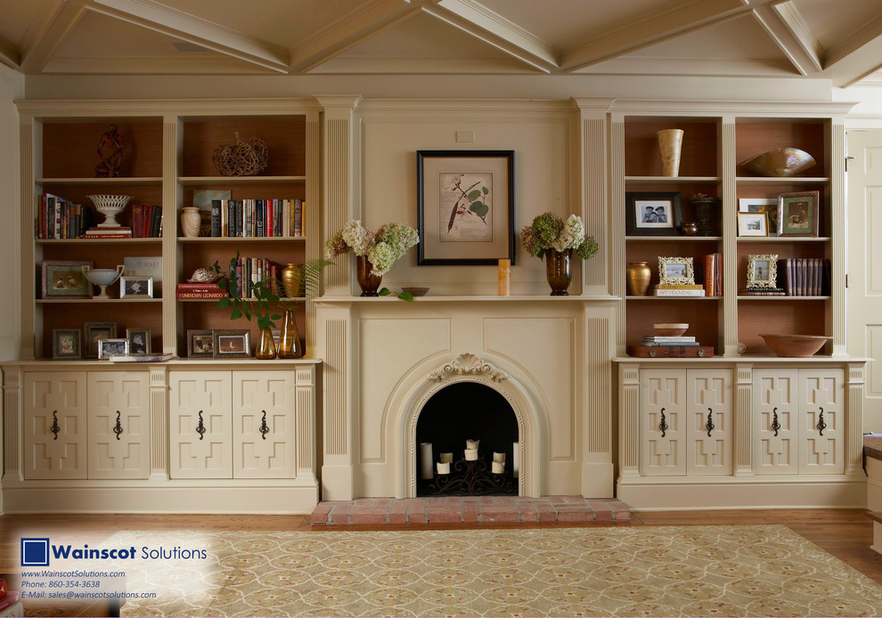 Family room library - mid-sized 1960s open concept medium tone wood floor family room library idea in New York with beige walls, a standard fireplace, a wood fireplace surround and no tv