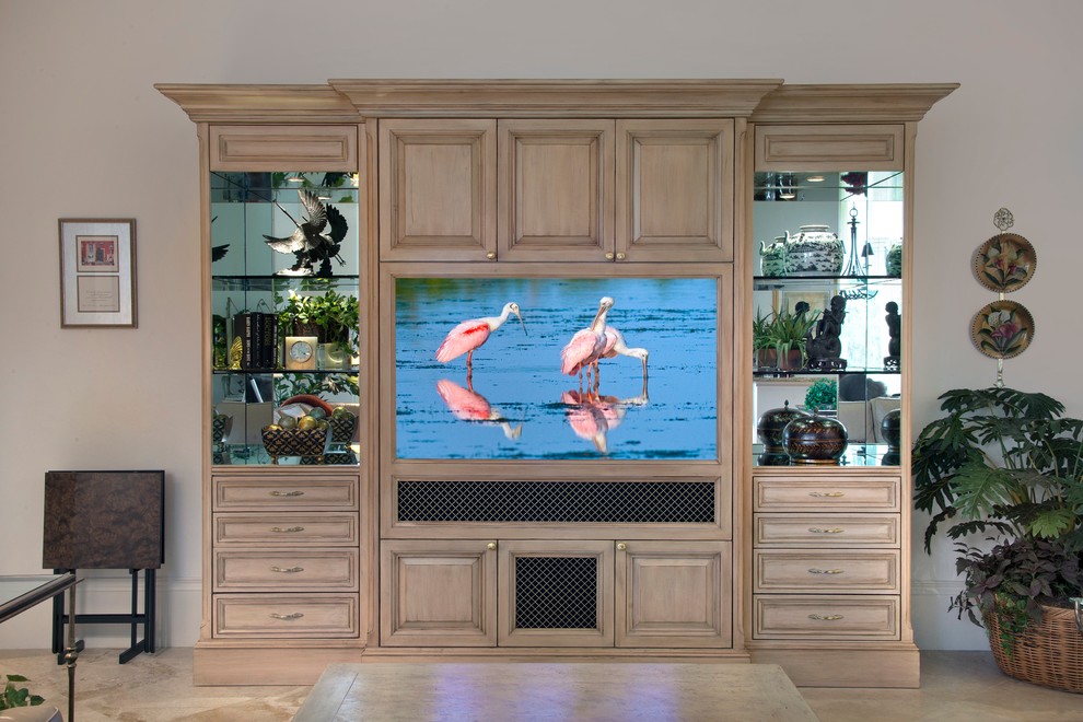 This is an example of a medium sized traditional open plan games room in Miami with beige walls, porcelain flooring, no fireplace, a built-in media unit and beige floors.