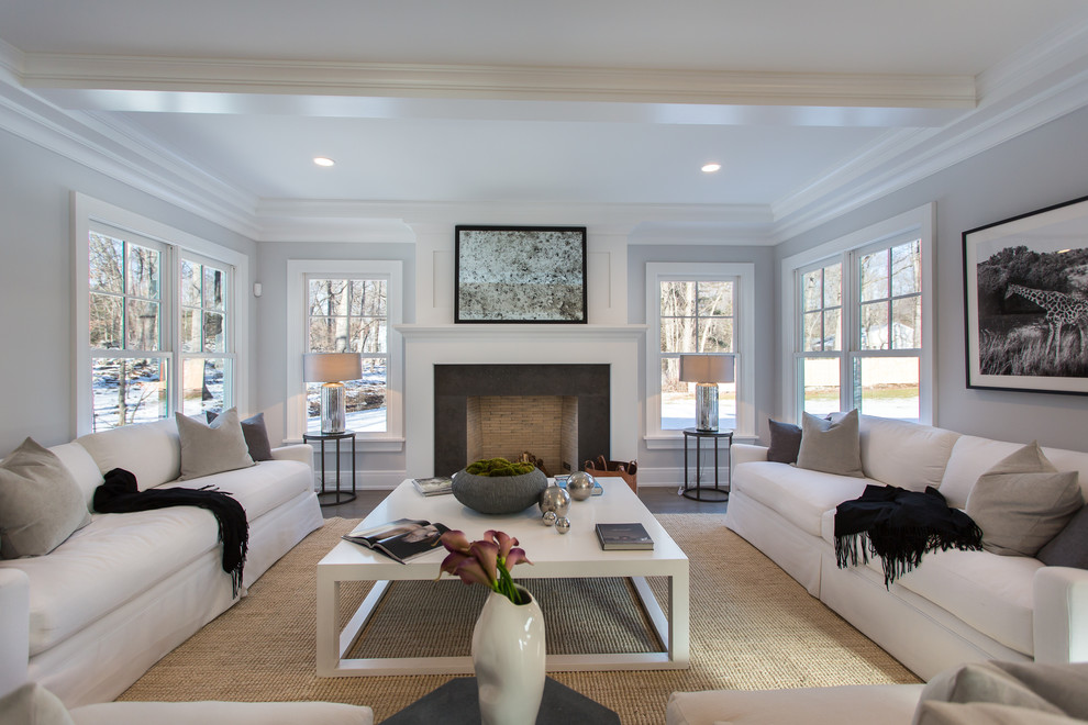 Example of a transitional family room design in New York with gray walls
