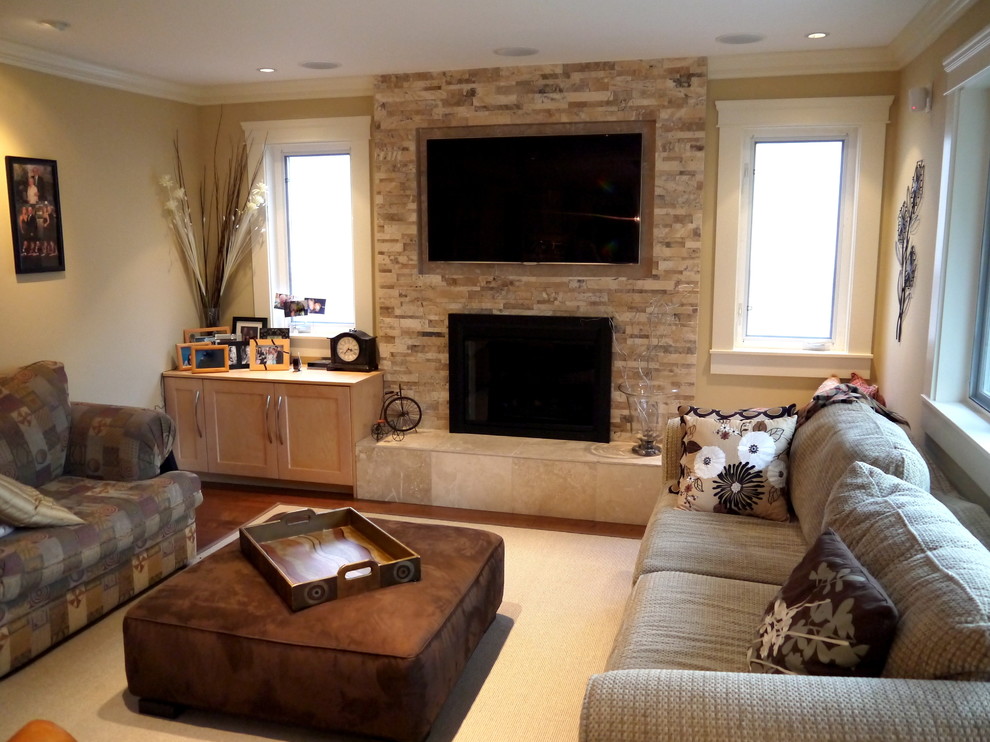 Transitional open concept medium tone wood floor family room photo in Vancouver with a standard fireplace, a stone fireplace and a wall-mounted tv