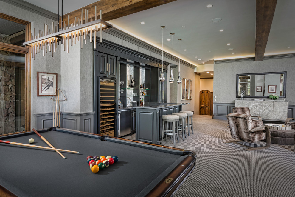 Example of a large transitional open concept carpeted and multicolored floor game room design in Denver with gray walls, a standard fireplace, a stone fireplace and no tv
