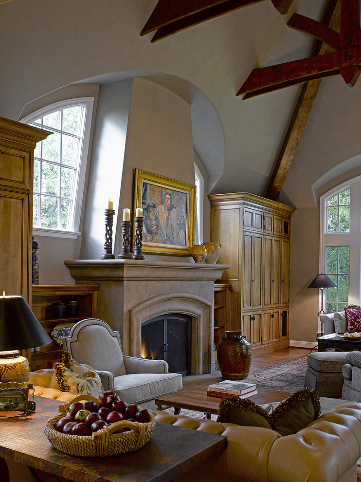 Traditional games room in San Francisco with beige walls, a standard fireplace and a stone fireplace surround.