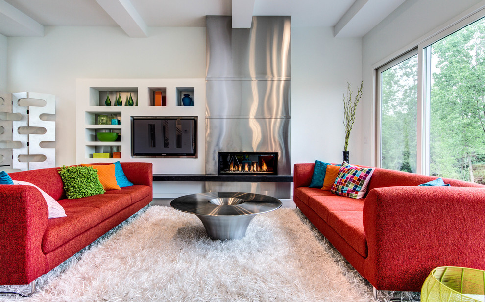 This is an example of a retro open plan games room in Grand Rapids with white walls, a ribbon fireplace and a built-in media unit.