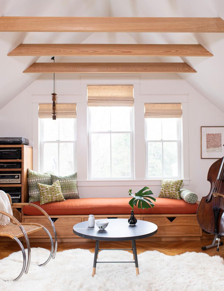 Inspiration for a contemporary games room in Portland Maine with white walls, medium hardwood flooring, brown floors, a vaulted ceiling and wood walls.
