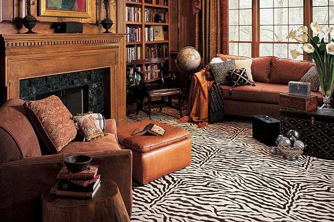 Große, Fernseherlose, Abgetrennte Rustikale Bibliothek mit Teppichboden, Kamin, Kaminumrandung aus Holz und brauner Wandfarbe in Detroit