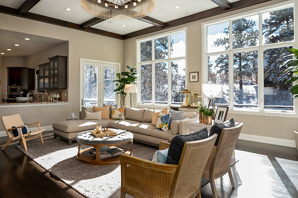 Mid-sized transitional open concept dark wood floor and brown floor family room photo in Denver with beige walls, a standard fireplace, a stone fireplace and no tv