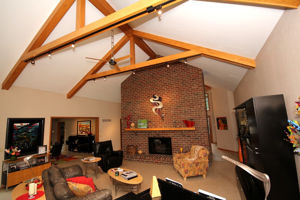 Example of a mid-sized arts and crafts open concept carpeted family room design in Other with a standard fireplace, a brick fireplace, a music area, white walls and a tv stand