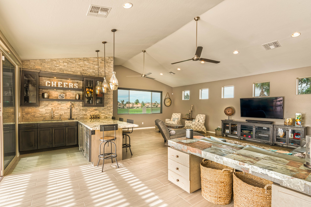 Inspiration for an expansive traditional open plan games room in Phoenix with beige walls, ceramic flooring, a wall mounted tv and a home bar.