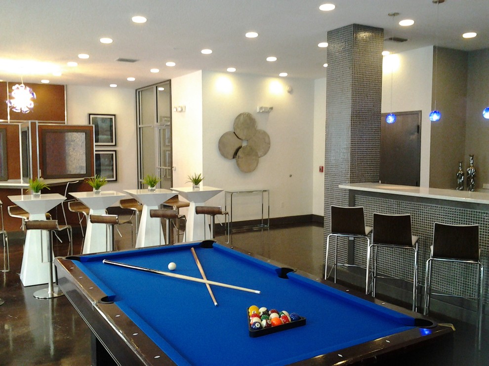 Example of a large trendy open concept concrete floor game room design in Tampa