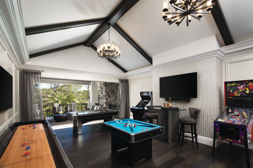Inspiration for a traditional games room in Miami with a game room, beige walls, dark hardwood flooring, a wall mounted tv and brown floors.