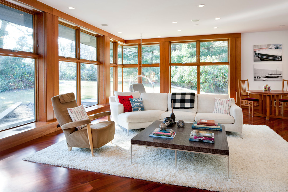 Inspiration for a contemporary open concept dark wood floor family room remodel in Boston