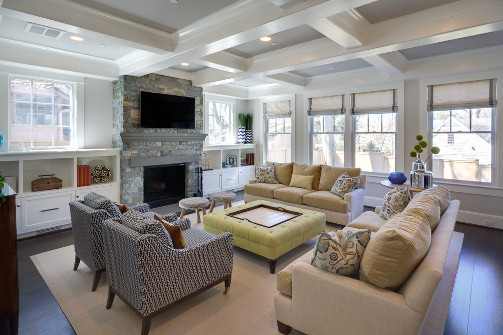 Example of a transitional dark wood floor family room design in DC Metro with white walls, a standard fireplace, a stone fireplace and a wall-mounted tv