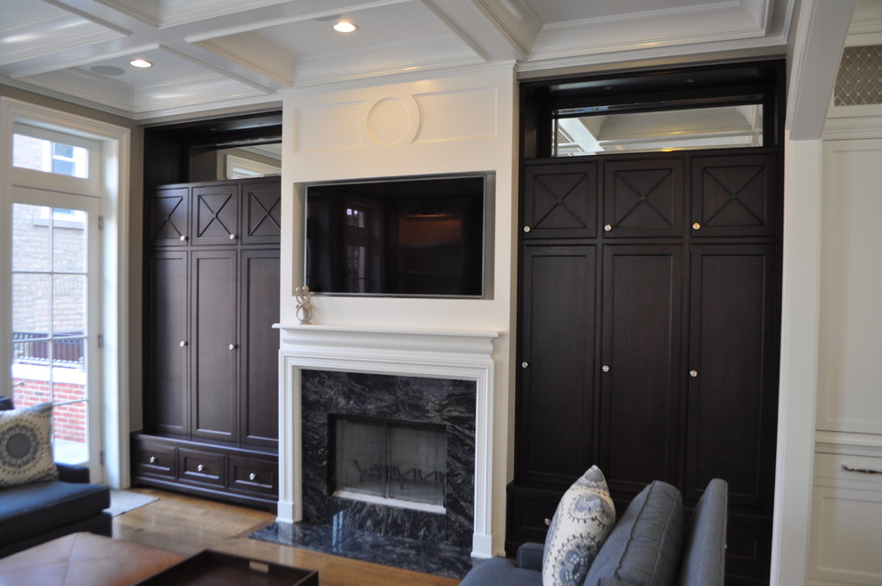 Medium sized classic open plan games room in Chicago with white walls, medium hardwood flooring, a standard fireplace, a stone fireplace surround and a wall mounted tv.