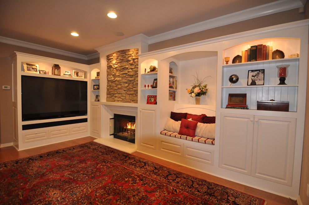 Medium sized rural enclosed games room in Los Angeles with beige walls, a standard fireplace, a stone fireplace surround and a built-in media unit.