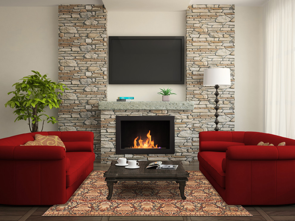 Ejemplo de sala de estar tradicional grande con paredes blancas, suelo de madera oscura, todas las chimeneas, marco de chimenea de piedra y televisor colgado en la pared