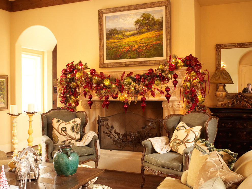 Example of a classic dark wood floor family room design in Houston with beige walls, a standard fireplace and a stone fireplace