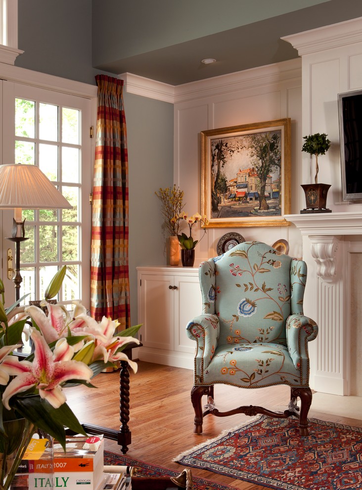 Inspiration for a large timeless medium tone wood floor family room remodel in Philadelphia with gray walls and a wall-mounted tv