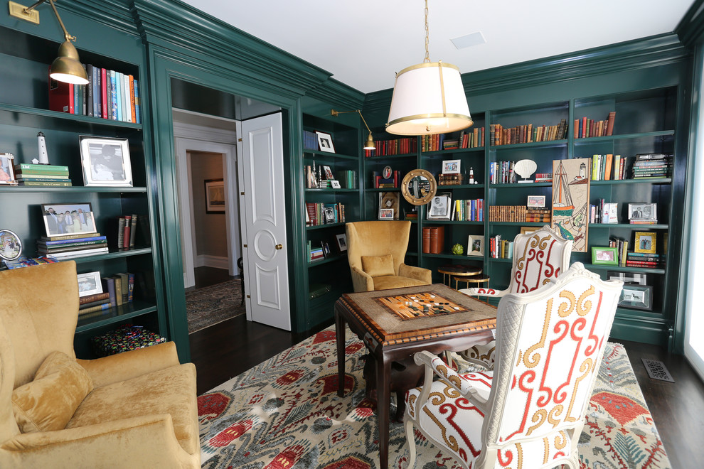 Inspiration for a large traditional enclosed games room in New York with a reading nook, green walls, dark hardwood flooring, no fireplace and brown floors.