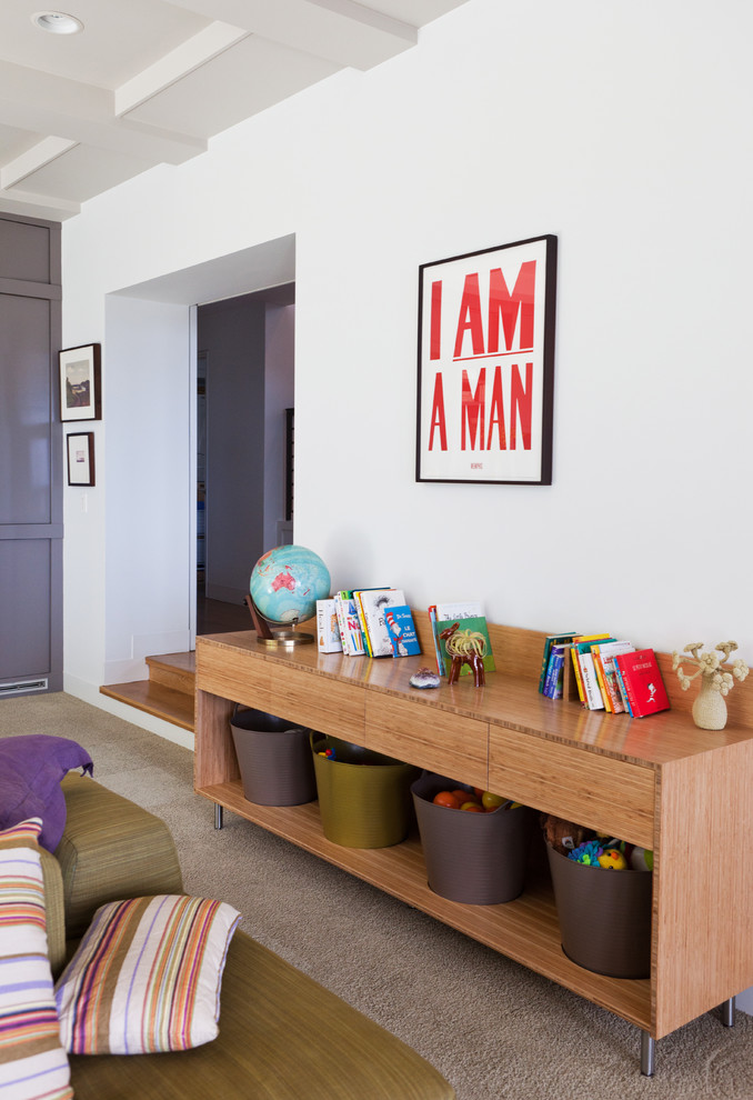 Trendy carpeted family room photo in Los Angeles with white walls