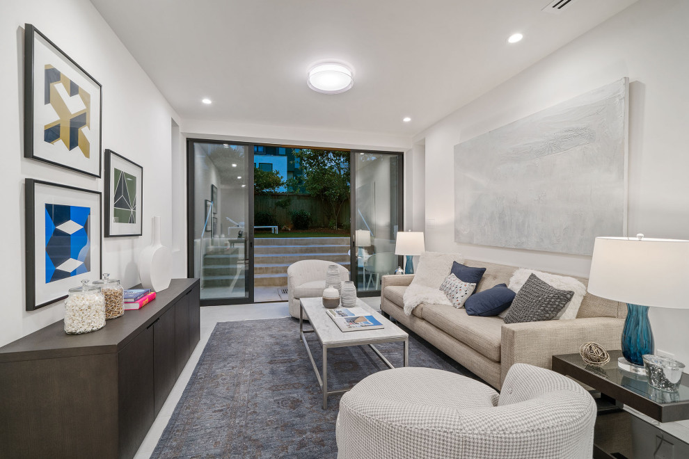 Medium sized contemporary open plan games room in San Francisco with white walls, porcelain flooring and grey floors.