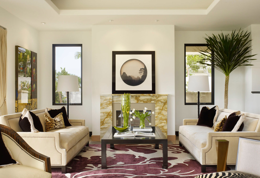 Living room photo in Los Angeles with white walls and a standard fireplace