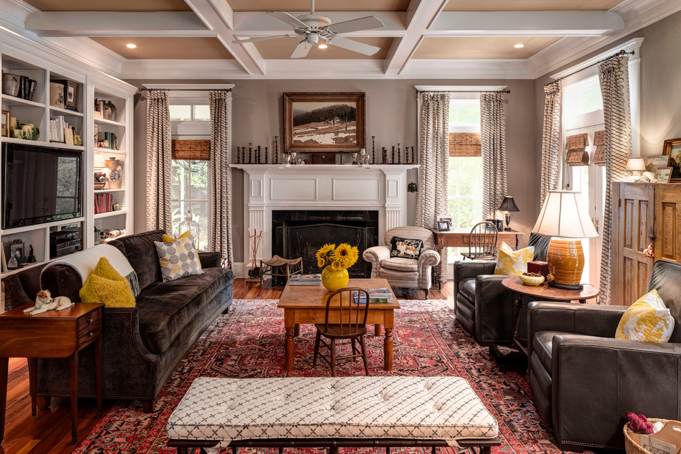 Family room - large traditional open concept medium tone wood floor family room idea in Atlanta with gray walls, a standard fireplace, a stone fireplace and a media wall