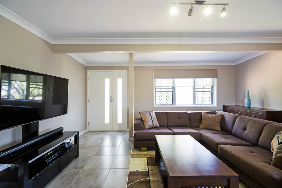 Example of a small minimalist open concept ceramic tile and gray floor family room design in Brisbane with beige walls, no fireplace and a wall-mounted tv