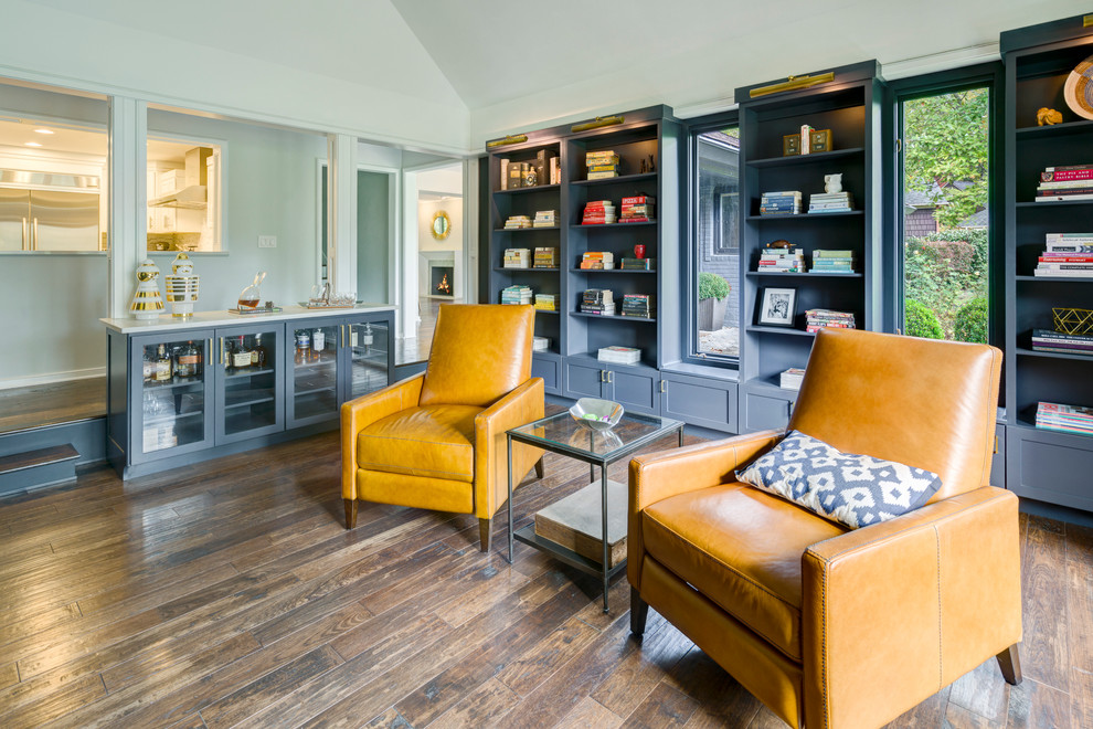 Inspiration for a large contemporary open concept medium tone wood floor family room library remodel in Los Angeles with gray walls, a standard fireplace, a stone fireplace and no tv