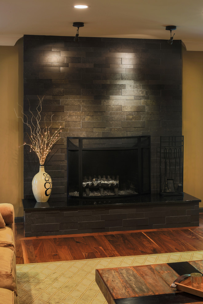 Inspiration for a large modern enclosed dark wood floor family room remodel in Charlotte with a music area, green walls, a standard fireplace, a tile fireplace and a media wall