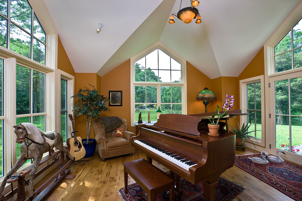 Trendy family room photo in Boston with a music area