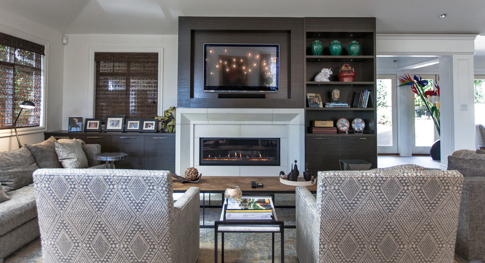 This is an example of a contemporary open plan games room in Vancouver with white walls, a ribbon fireplace and a wall mounted tv.